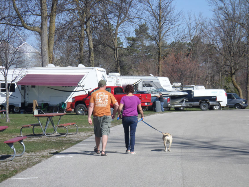 City of Au Gres Riverfront Campground campers walking dog